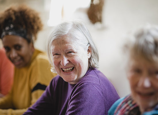 3 women smiling and laughing